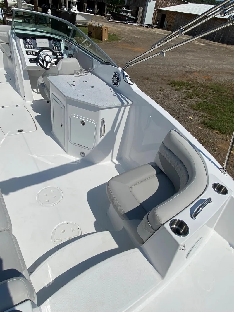 Slide: The Image of 2023 Hurricane SD 2690 OB boat interior with seating and control panel. - 13