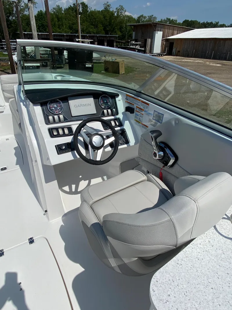 Slide: The Image of 2023 Hurricane SD 2690 OB boat cockpit with steering wheel and control panel. - 15
