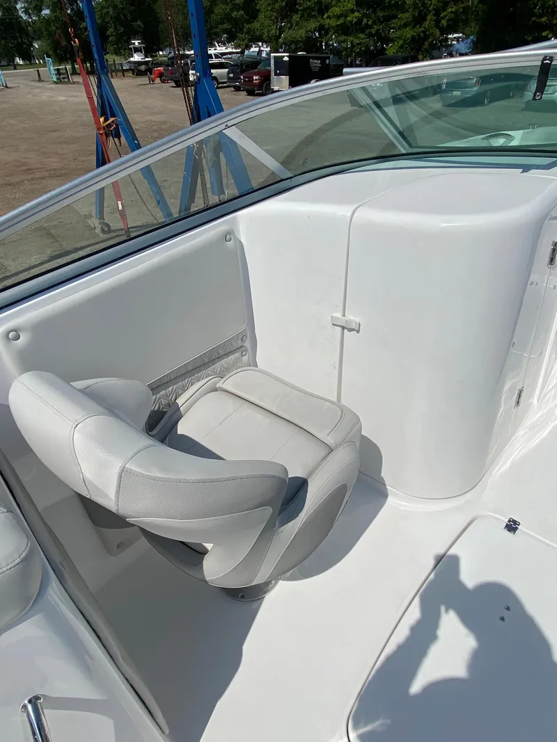Slide: The Image of 2023 Hurricane SD 2690 OB boat interior with white seating and sleek design. - 16
