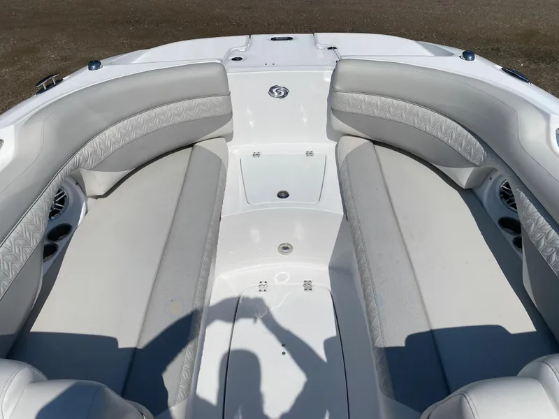 Slide: The Image of 2023 Hurricane SD 2690 OB boat interior with gray seating and white deck. - 19