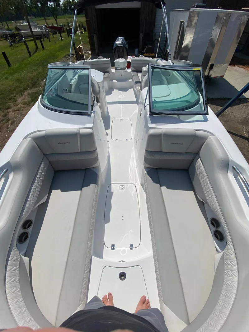 Slide: The Image of 2023 Hurricane SD 2690 OB boat interior with spacious seating and open deck layout. - 21