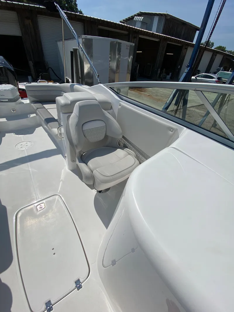 Slide: The Image of 2023 Hurricane SD 2690 OB boat interior with white seating and sleek design. - 23