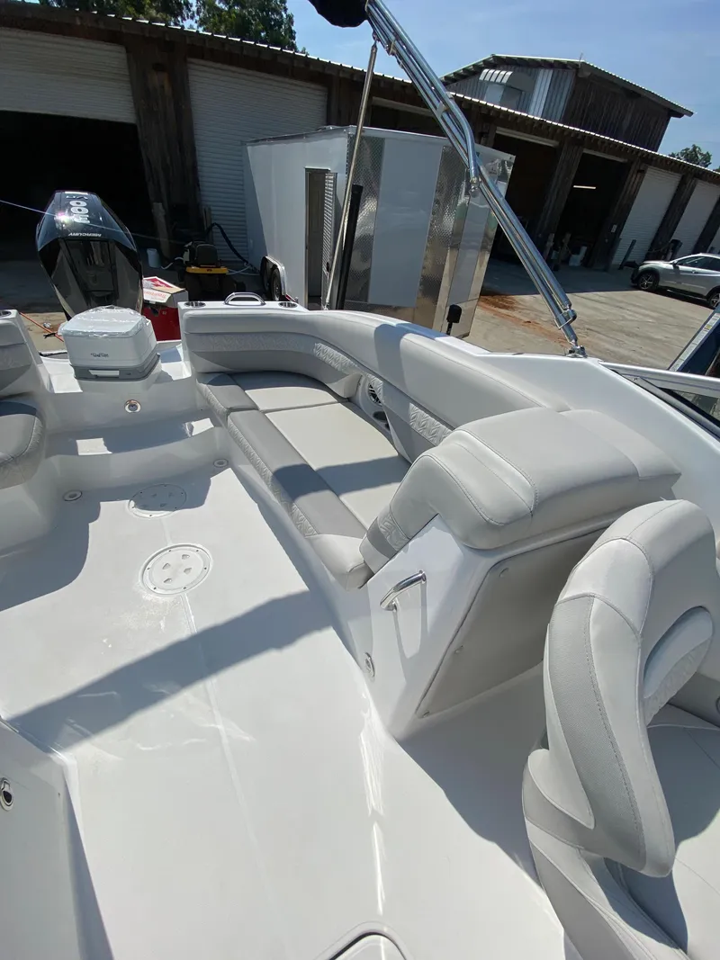 Slide: The Image of 2023 Hurricane SD 2690 OB boat interior with white seating and modern design. - 24