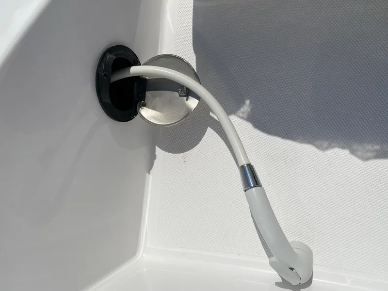 Slide: The Image of 2023 Hurricane SD 2690 OB boat shower hose in white interior. - 27