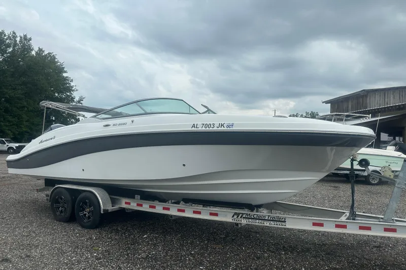 Slide: The Image of 2023 Hurricane SD 2690 OB boat on trailer under cloudy sky. - 28