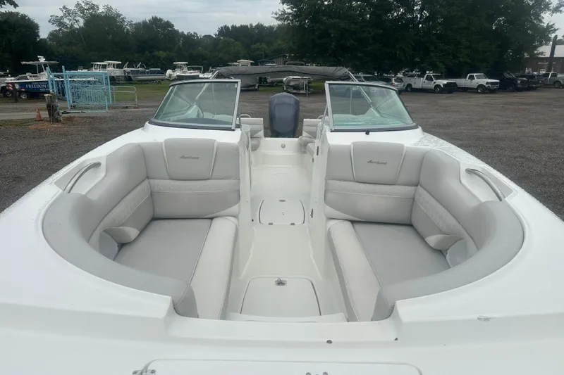 Slide: The Image of 2023 Hurricane SD 2690 OB boat with spacious seating, parked outdoors. - 36