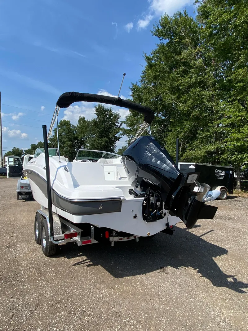 Slide: The Image of 2023 Hurricane SD 2690 OB boat on trailer, parked outdoors, sunny day. - 4