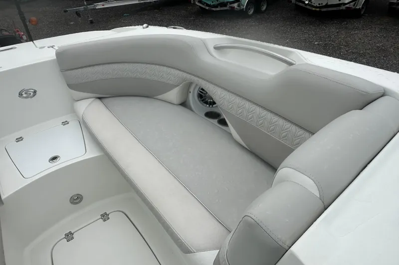 Slide: The Image of 2023 Hurricane SD 2690 OB boat interior with gray seating and storage compartments. - 40