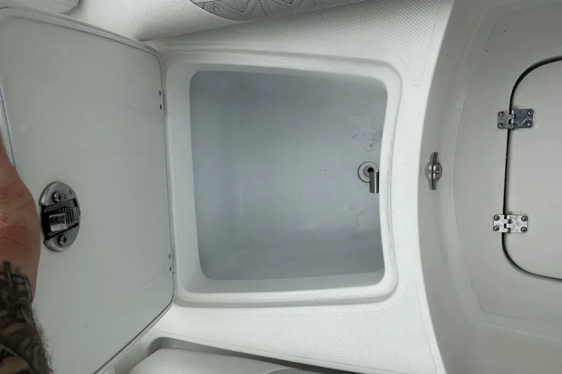 Slide: The Image of Open storage compartment on 2023 Hurricane SD 2690 OB boat. - 42