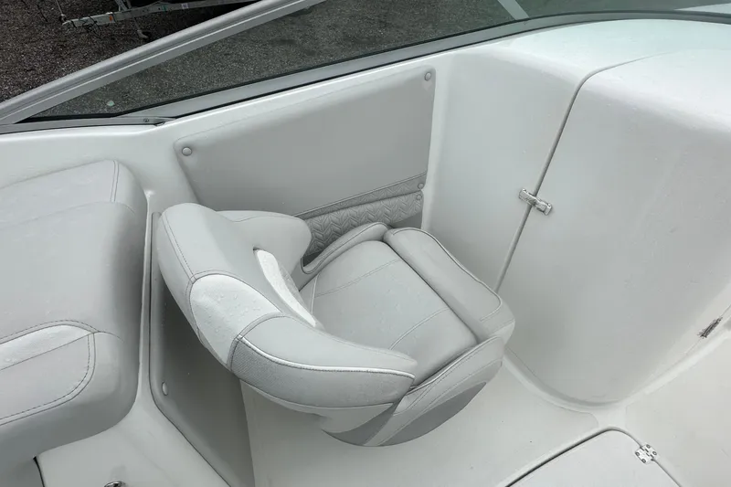 Slide: The Image of 2023 Hurricane SD 2690 OB boat interior with white cushioned seating. - 47