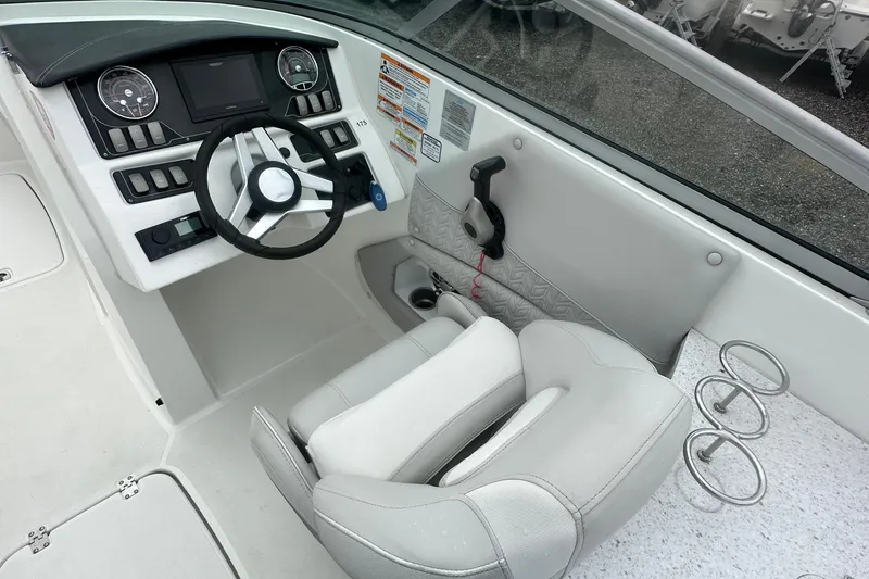 Slide: The Image of 2023 Hurricane SD 2690 OB boat cockpit with modern steering and controls. - 48