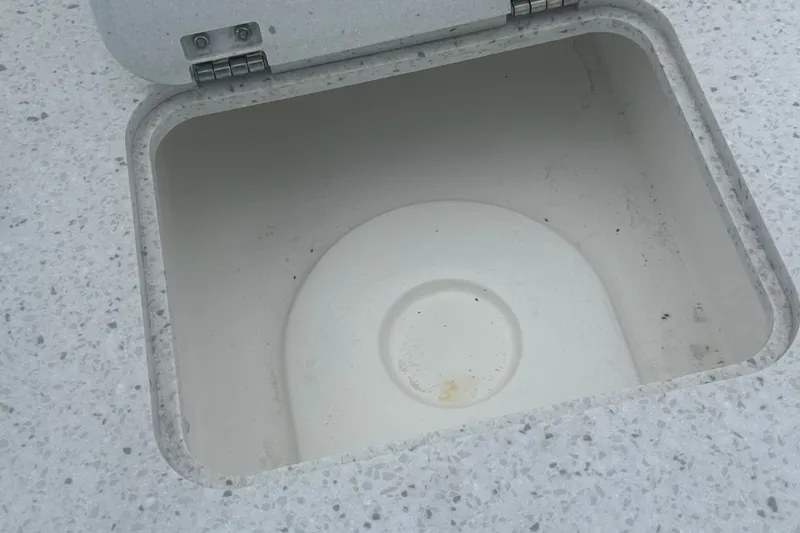 Slide: The Image of Open storage compartment on 2023 Hurricane SD 2690 OB boat. - 54