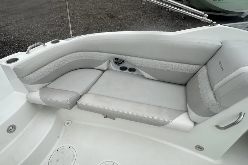 Slide: The Image of 2023 Hurricane SD 2690 OB boat interior with gray cushioned seating and cup holders. - 57