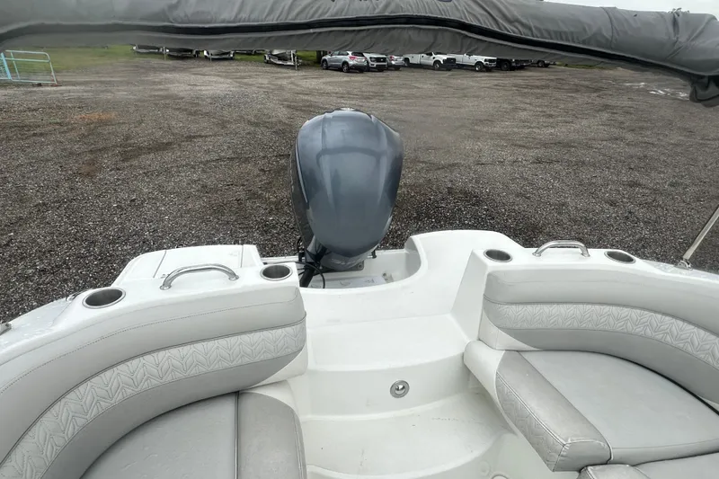 Slide: The Image of 2023 Hurricane SD 2690 OB boat with outboard motor and cushioned seating. - 58