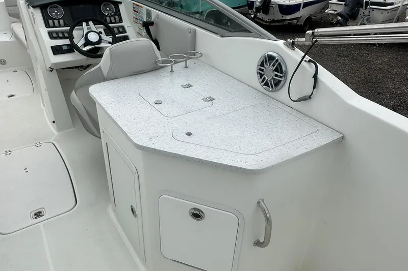 Slide: The Image of 2023 Hurricane SD 2690 OB boat interior with helm and countertop. - 61