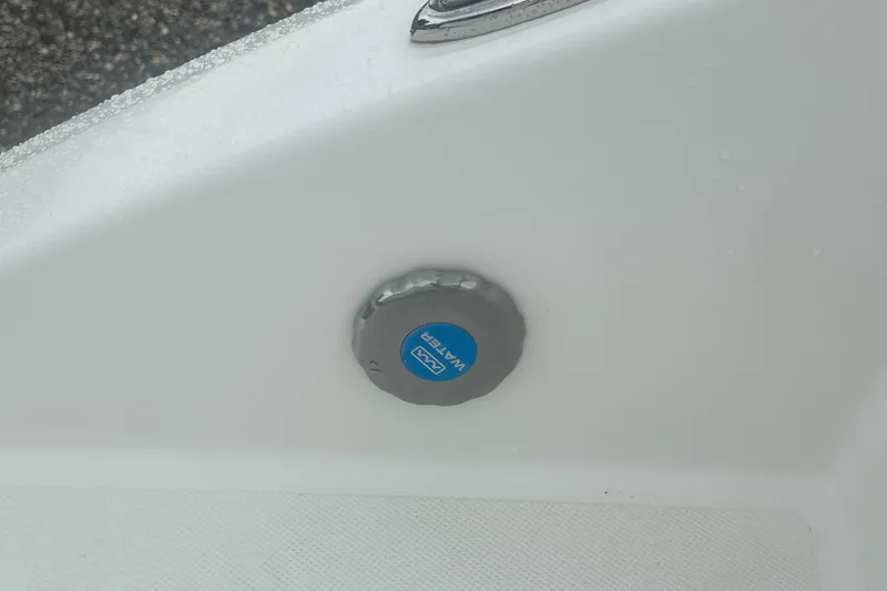 Slide: The Image of Water inlet on 2023 Hurricane SD 2690 OB boat, featuring a blue cap. - 66