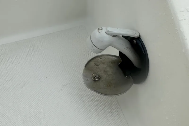Slide: The Image of 2023 Hurricane SD 2690 OB boat showerhead with protective cover in white interior. - 67