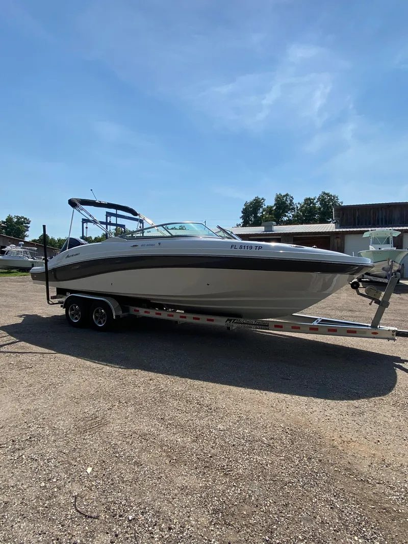 Slide: The Image of 2023 Hurricane SD 2690 OB boat on trailer under clear blue sky. - 8