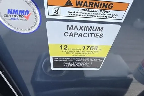 Slide: The Image of Warning label on 2023 Avalon 2380 VENTURE CRUISE showing maximum capacity and safety instructions. - 10