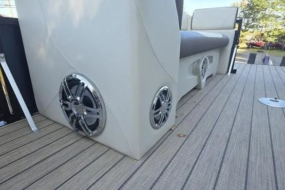 Slide: The Image of 2023 Avalon 2380 VENTURE CRUISE boat interior with speakers and seating on deck. - 11