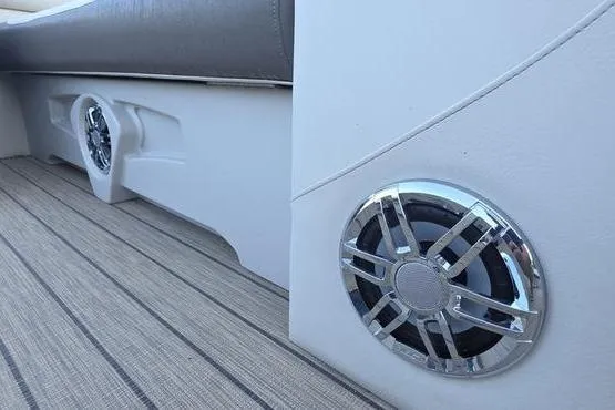 Slide: The Image of 2023 Avalon 2380 VENTURE CRUISE boat interior with sleek speakers and cushioned seating. - 12