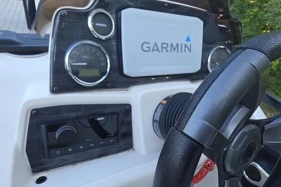 Slide: The Image of Dashboard of 2023 Avalon 2380 Venture Cruise with Garmin navigation system. - 13