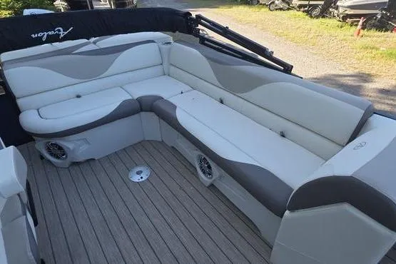 Slide: The Image of 2023 Avalon 2380 Venture Cruise boat interior with plush seating and modern design. - 14