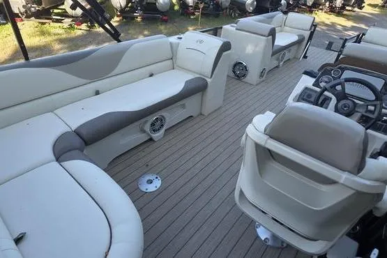 Slide: The Image of 2023 Avalon 2380 VENTURE CRUISE pontoon boat interior with plush seating and modern helm. - 17