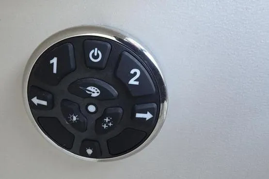 Slide: The Image of Control panel of 2023 Avalon 2380 VENTURE CRUISE with various function buttons. - 19