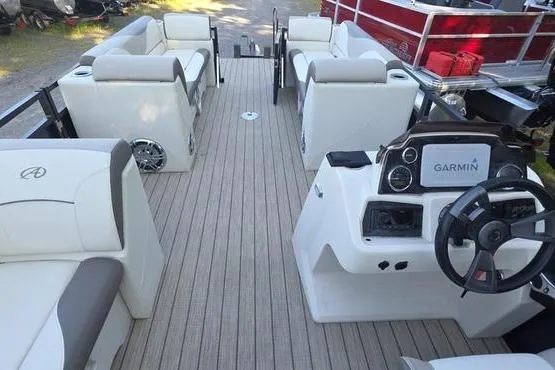 Slide: The Image of 2023 Avalon 2380 VENTURE CRUISE pontoon boat interior with seating and Garmin navigation system. - 3