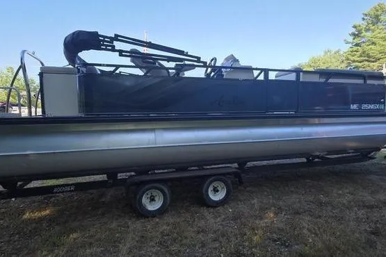 Slide: The Image of 2023 Avalon 2380 VENTURE CRUISE pontoon boat on trailer, parked on grass. - 5