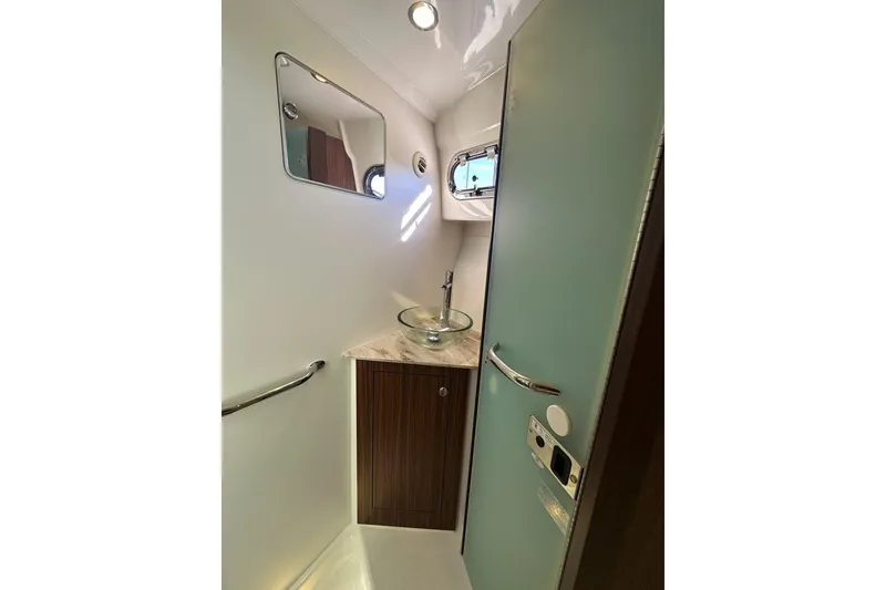 Slide: The Image of Luxurious bathroom in 2020 Pursuit OS 355 Offshore boat with modern fixtures. - 31