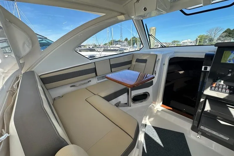 Slide: The Image of Luxurious interior of 2020 Pursuit OS 355 Offshore boat with comfortable seating. - 4