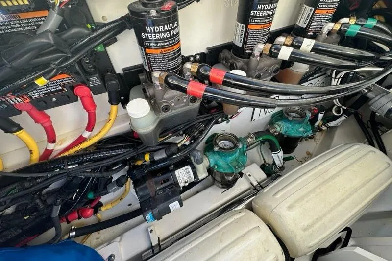 Slide: The Image of Engine compartment of 2020 Pursuit OS 355 Offshore boat, showcasing mechanical components. - 46