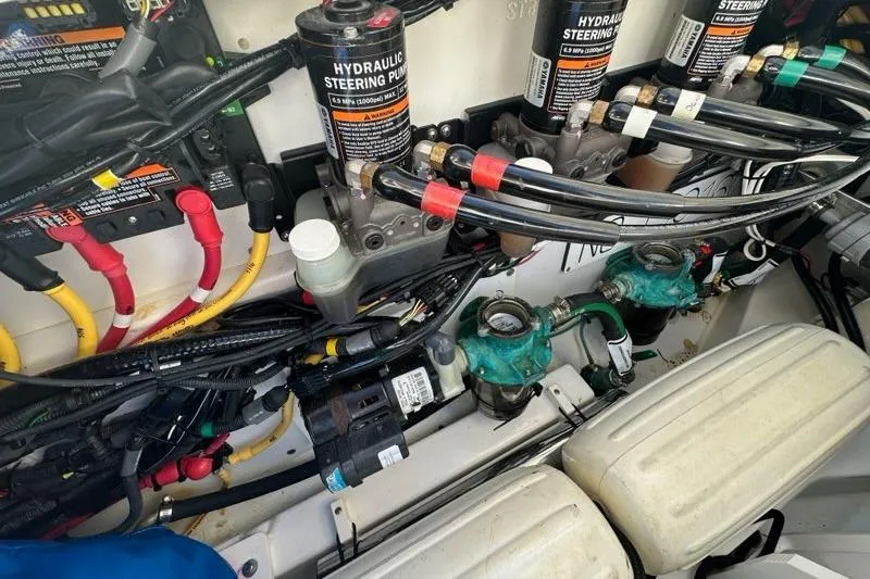 Slide: The Image of 2020 Pursuit OS 355 Offshore hydraulic steering system with pumps and wiring. - 47