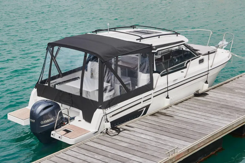 The Image of 2024 Jeanneau NC Weekender 795 Series 2 boat on trailer, side view. - 0