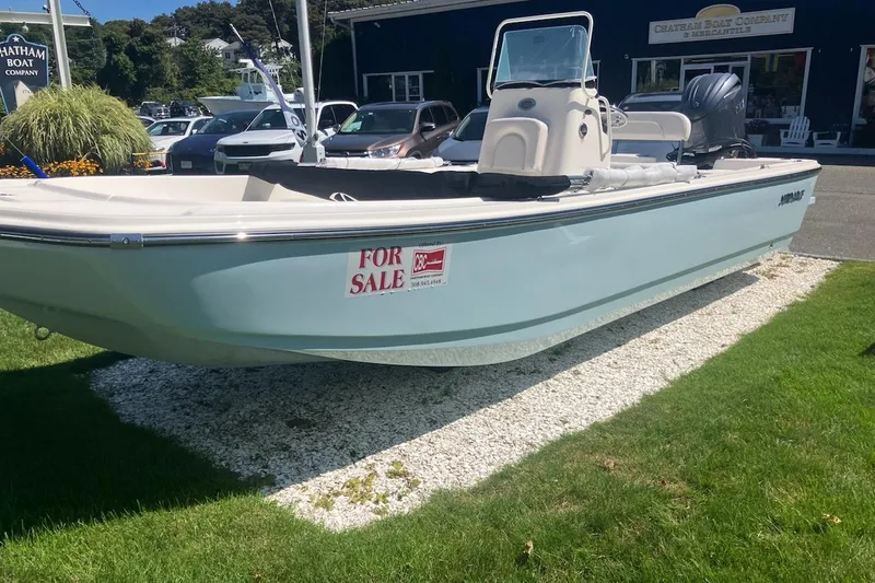 The Image of 2026 Sundance DX22 boat for sale, displayed outdoors on grass and gravel. - 0
