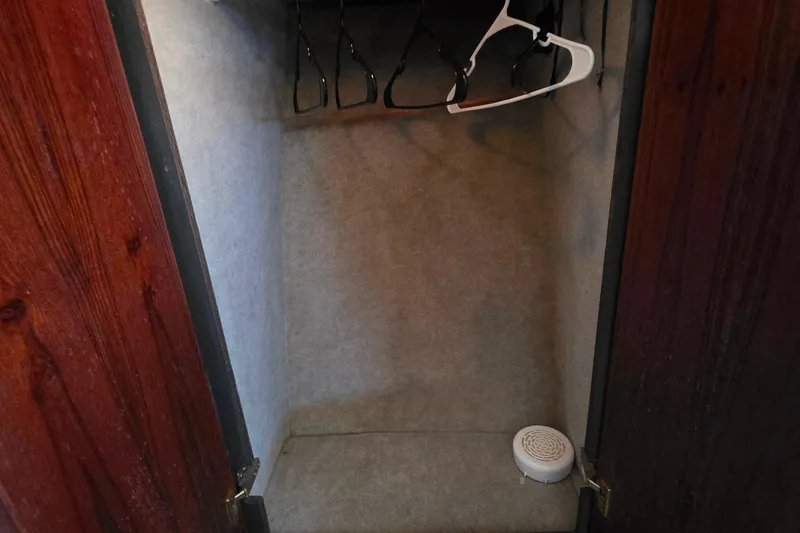 Slide: The Image of Empty closet with hangers in 1985 Bayliner 4550 Motoryacht. - 32