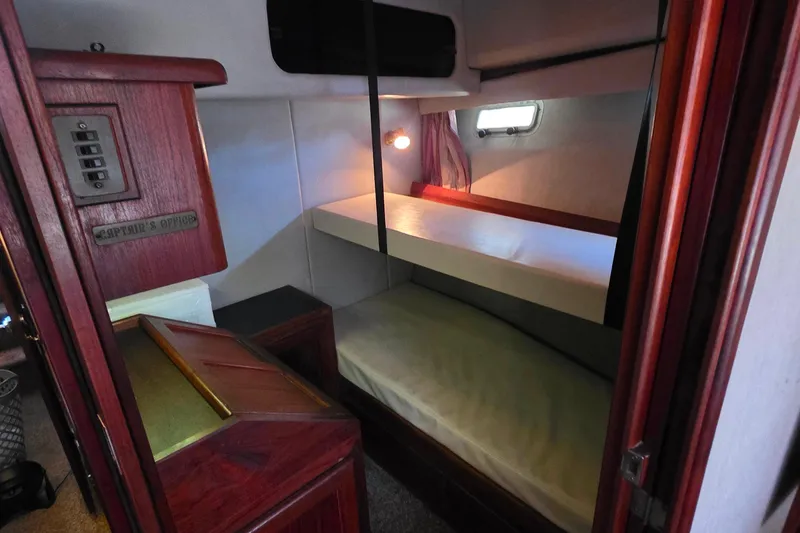Slide: The Image of Interior cabin of 1985 Bayliner 4550 Motoryacht with bunk beds and wooden cabinetry. - 35