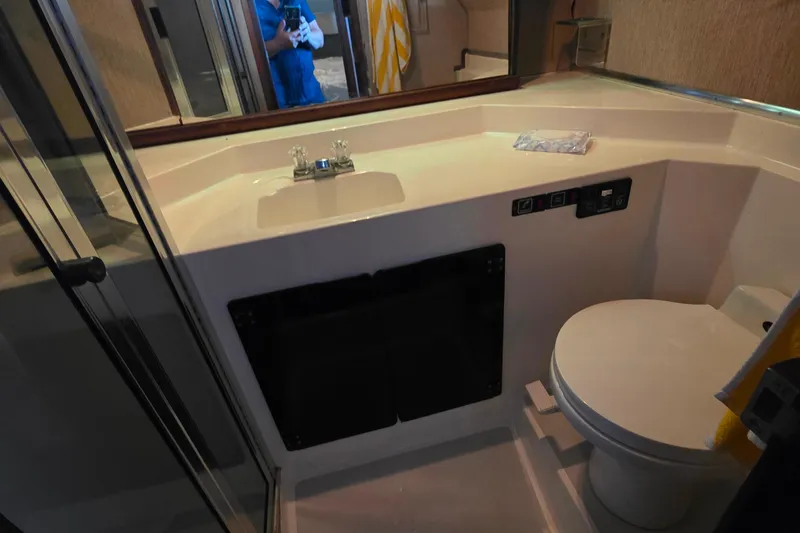 Slide: The Image of Bathroom interior of 1985 Bayliner 4550 Motoryacht, featuring sink and toilet. - 47