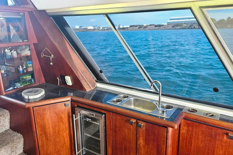 Slide: The Image of Interior of 1985 Bayliner 4550 Motoryacht with ocean view through large windows. - 63