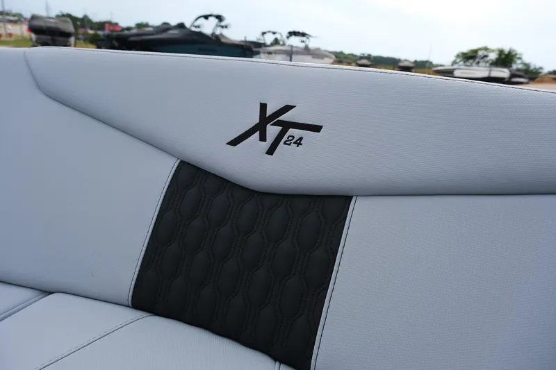 Slide: The Image of 2026 MasterCraft XT24 boat interior with logo detail on upholstery. - 22