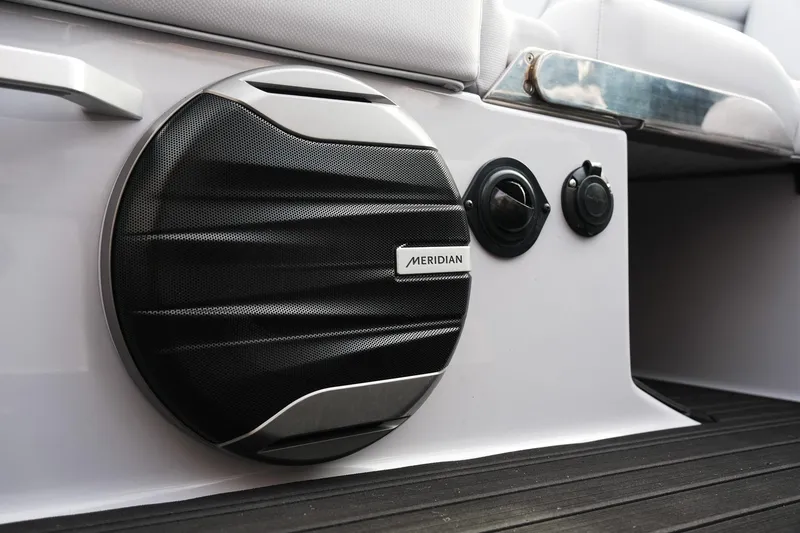 Slide: The Image of 2026 MasterCraft XT24 boat interior with Meridian speaker and sleek design. - 23