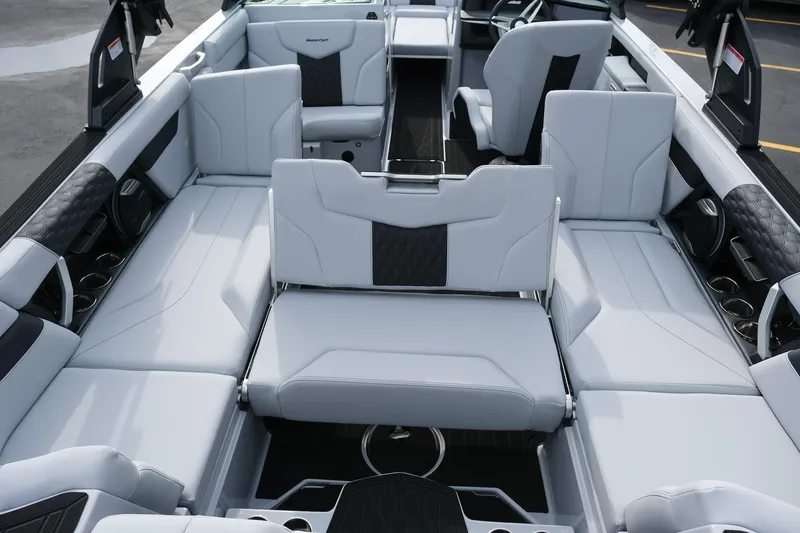 Slide: The Image of 2026 MasterCraft XT24 boat interior with luxurious seating and modern design. - 25