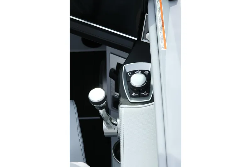 Slide: The Image of 2026 MasterCraft XT24 boat control panel with joystick and buttons. - 30