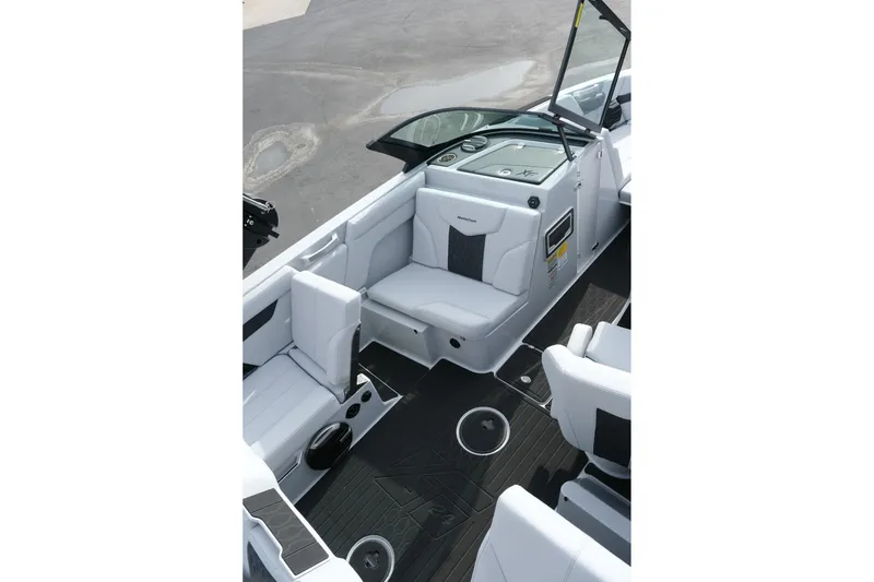 Slide: The Image of 2026 MasterCraft XT24 boat interior with sleek seating and modern dashboard design. - 31