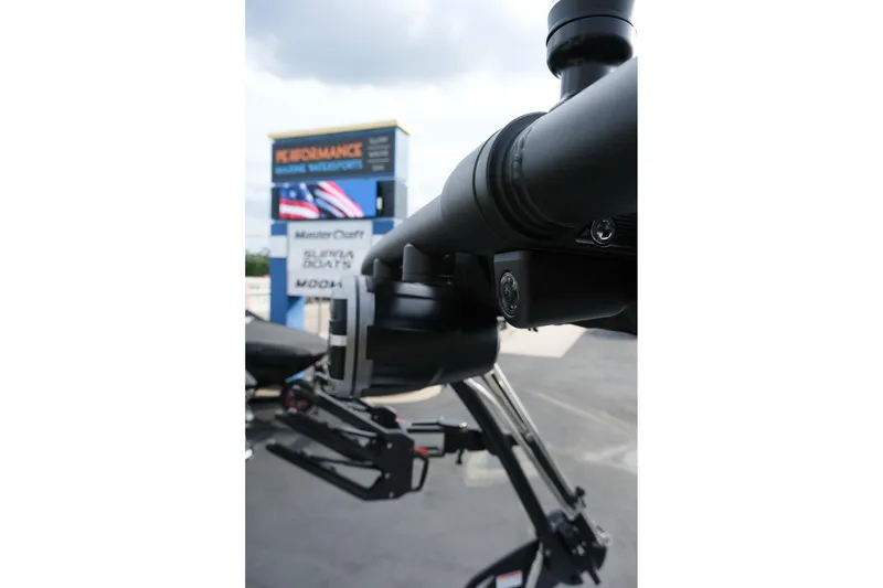 Slide: The Image of Close-up of 2026 MasterCraft XT24 boat equipment with dealership signage in background. - 32