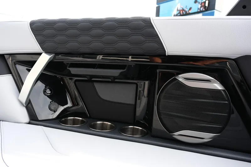 Slide: The Image of Interior of 2026 MasterCraft XT24 boat with speaker and cup holders. - 33