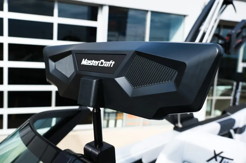 Slide: The Image of 2026 MasterCraft XT24 boat with advanced audio system, close-up view. - 38