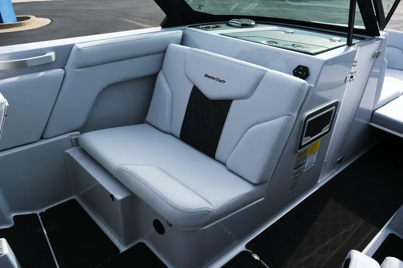 Slide: The Image of 2026 MasterCraft XT24 boat interior with sleek white seating and modern design. - 41